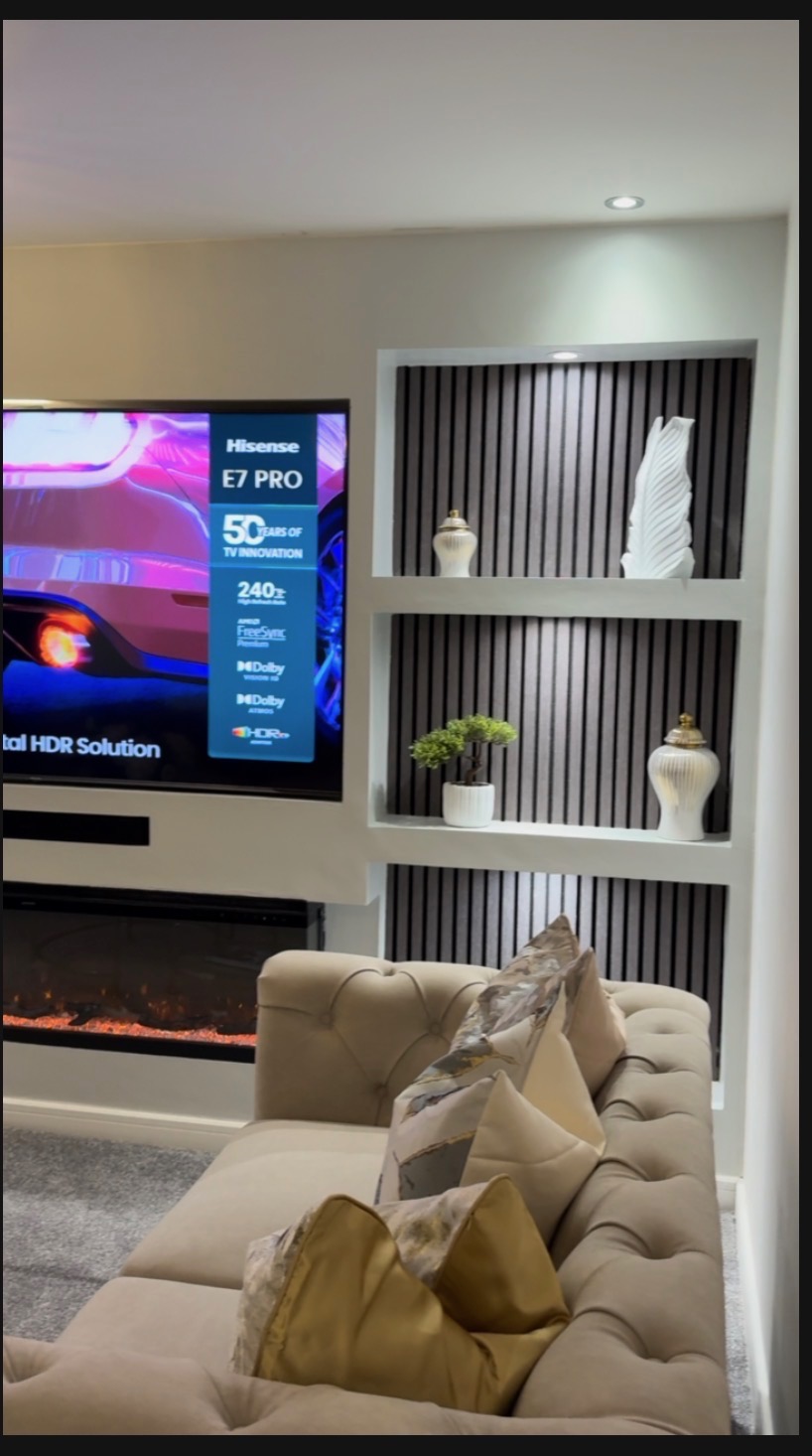 Slatted media wall with sculptural ceramics and integrated fire