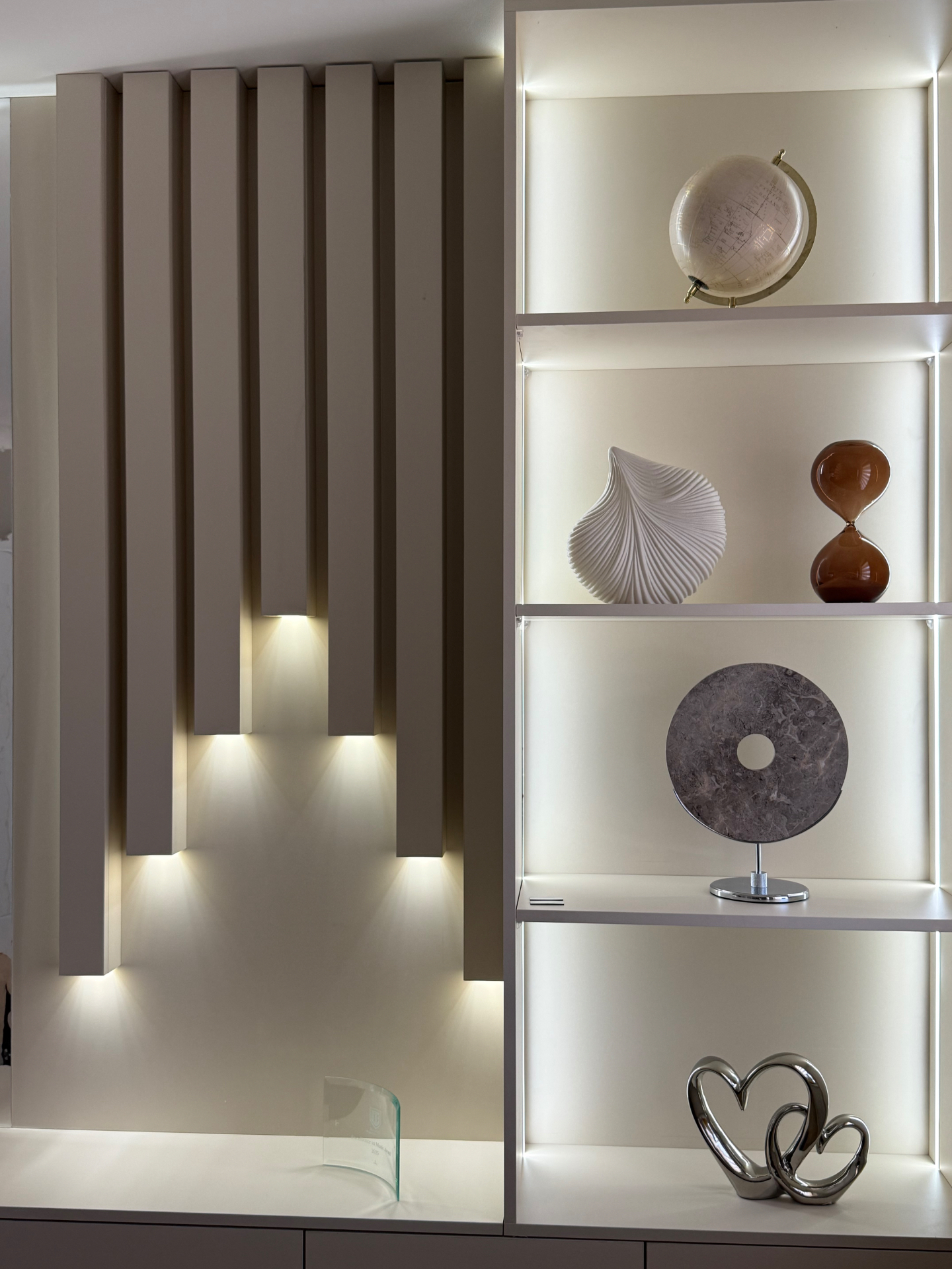 Fluted feature wall with integrated lighting and lit display niches